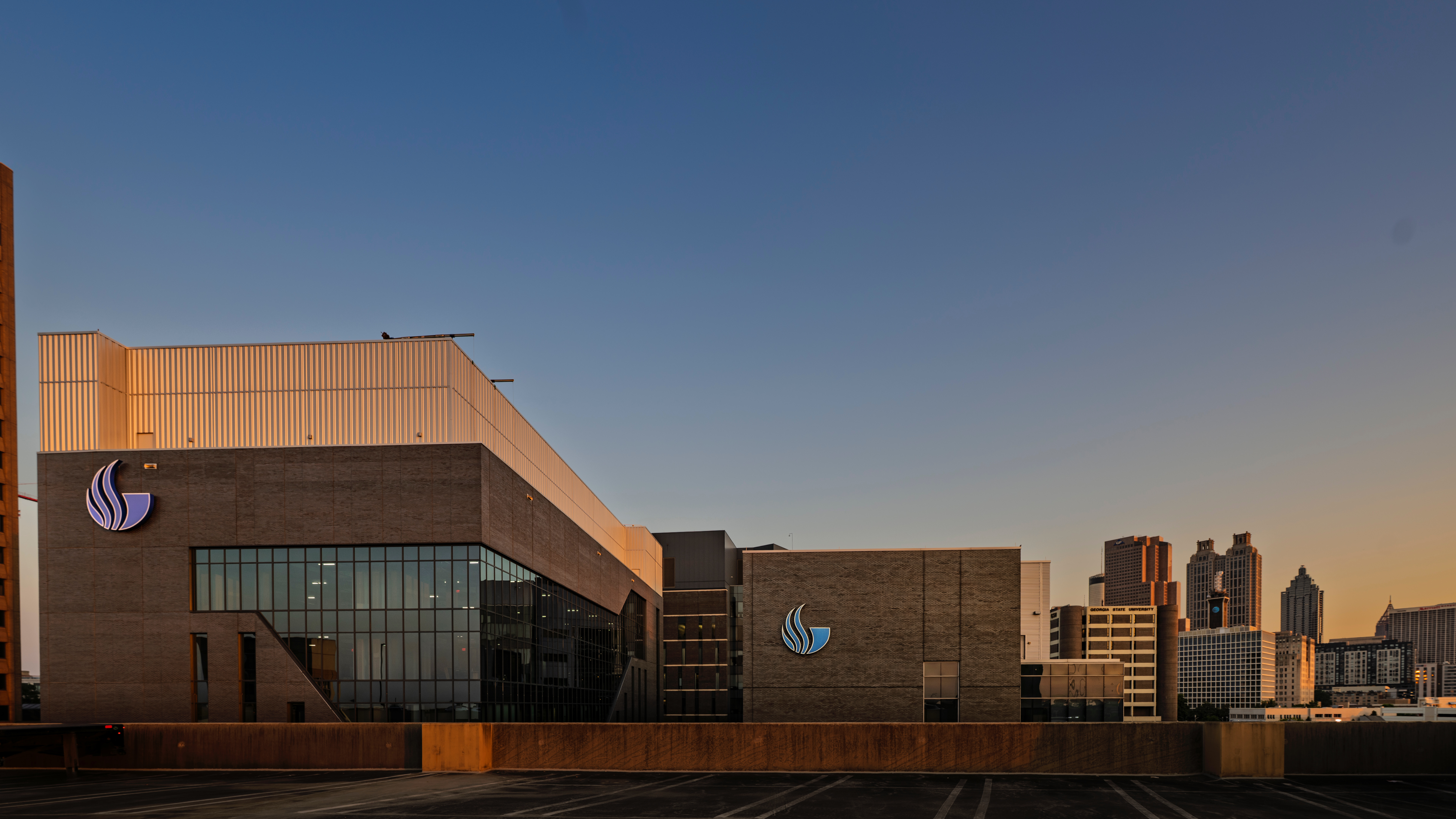 Georgia State University's Science Tower at sunset, with the downtown Atlanta skyline behind it